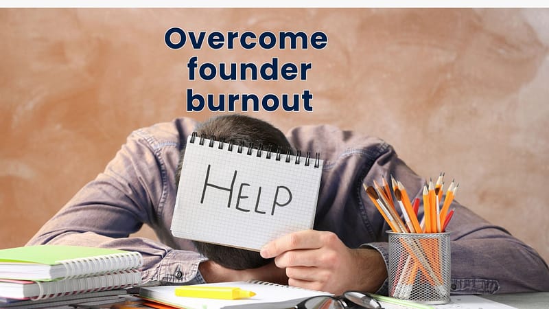 A stressed startup founder with their head on a desk, holding a notepad that says "HELP." This image represents the struggle to overcome founder burnout.